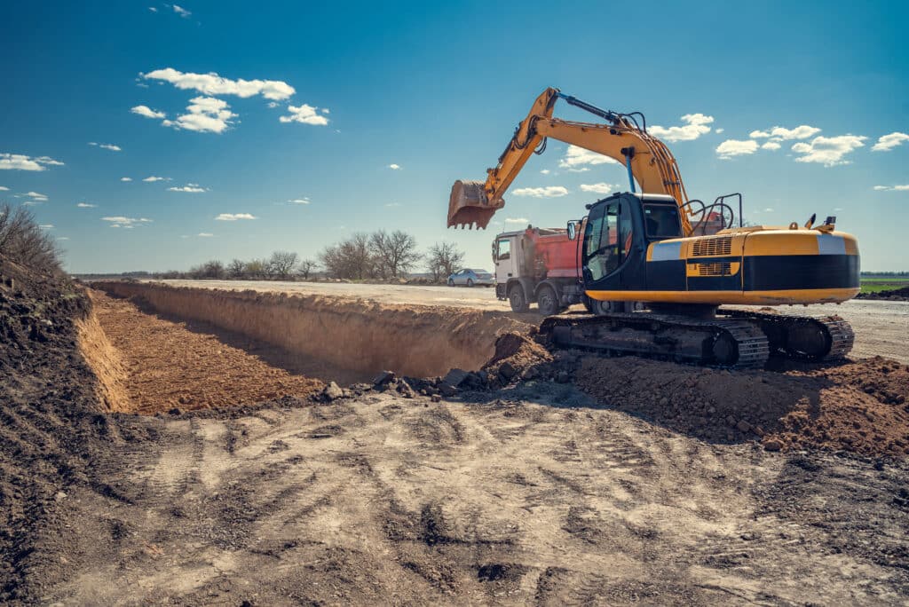 The excavator does earthwork. Digging a pit.